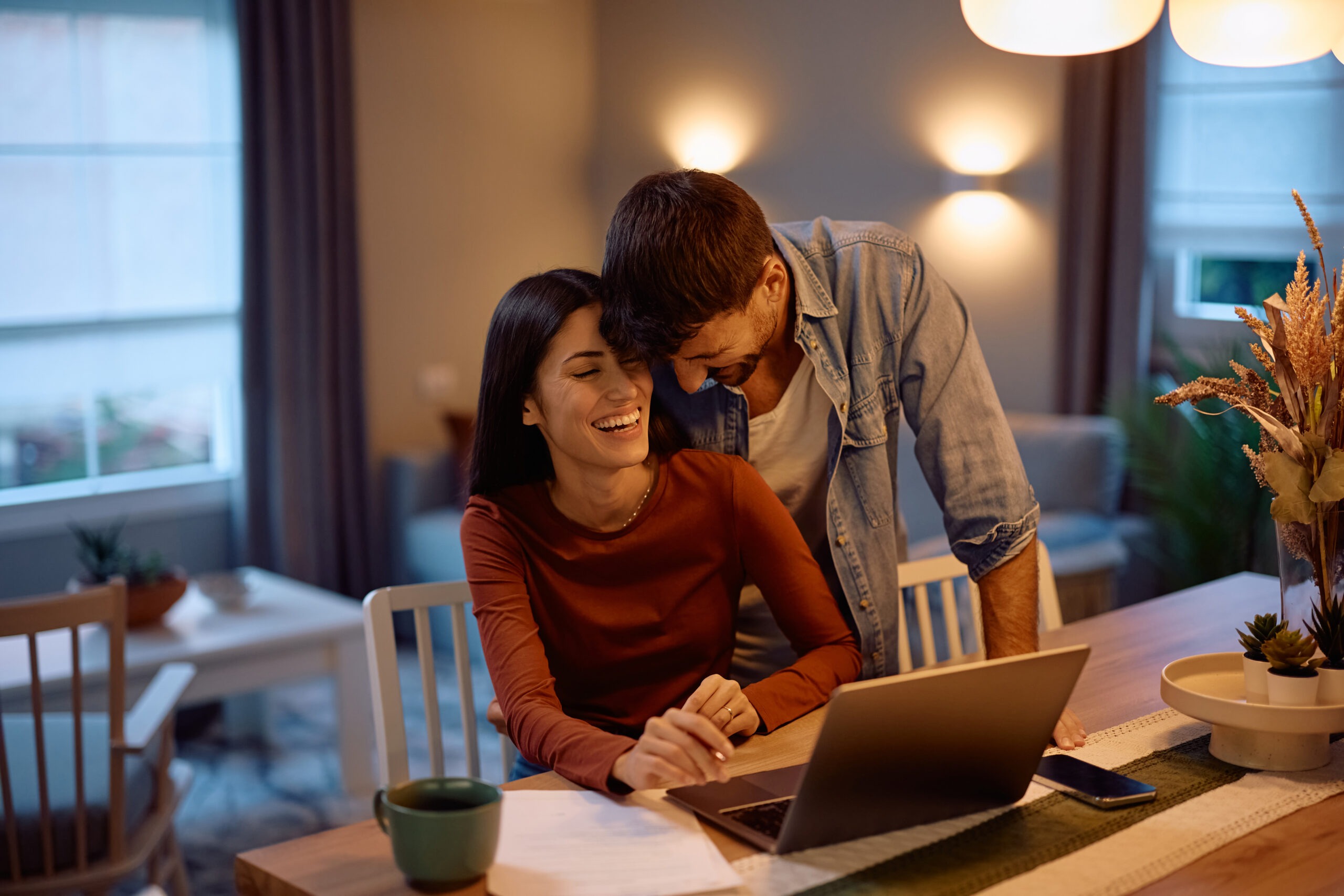 American couple reviewing work and relocation plans for living and working in Italy from home