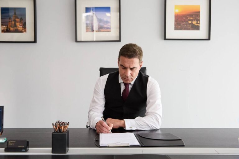Italian citizenship attorney reviewing legal documents during a client consultation