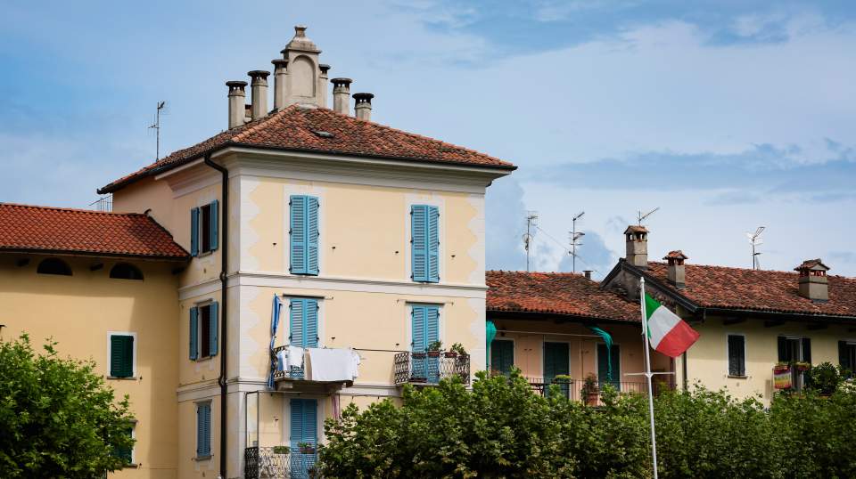 Charming buildings and vibrant colors in Isola Bella Italy with a sunny sky backdrop