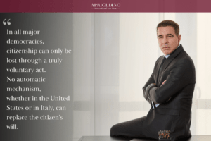 Attorney Aprigliano standing with his arms crossed beside a desk. On the left side of the image, a large quote appears in white text: “In all major democracies, citizenship can only be lost through a truly voluntary act. No automatic mechanism, whether in the United States or in Italy, can replace the citizen’s will.”
