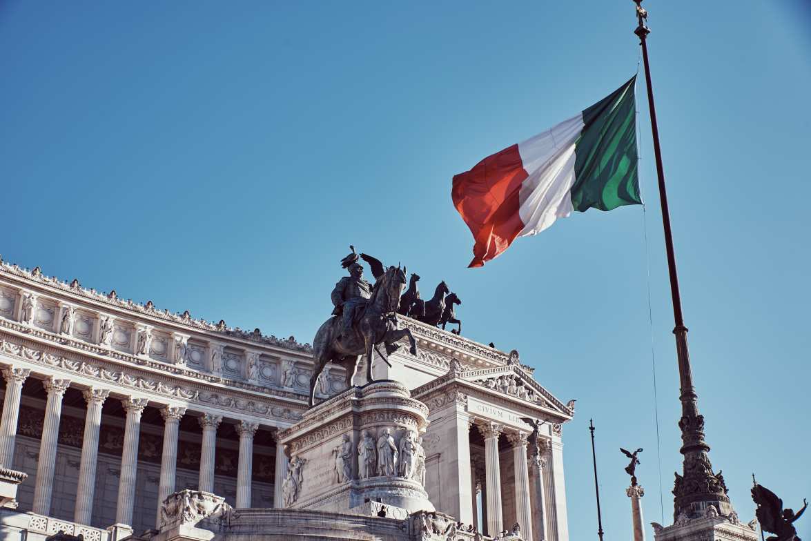 Monument to the homeland with the official flag of the Italian country