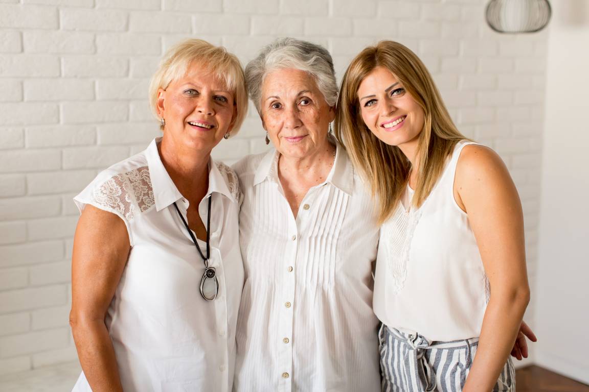Portrait of a smiling woman , grandmother and granddaughter