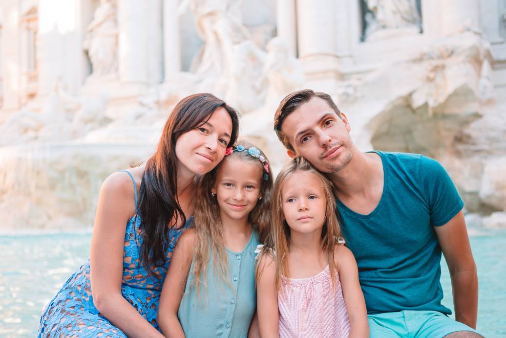Portrait of family at Fontana di Trevi, Rome, Italy