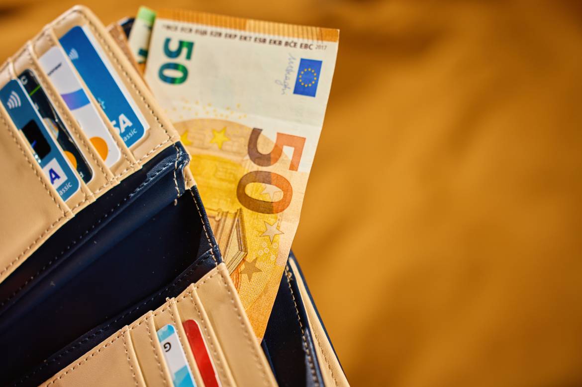 Wallet with euro banknotes in cash and credit cards