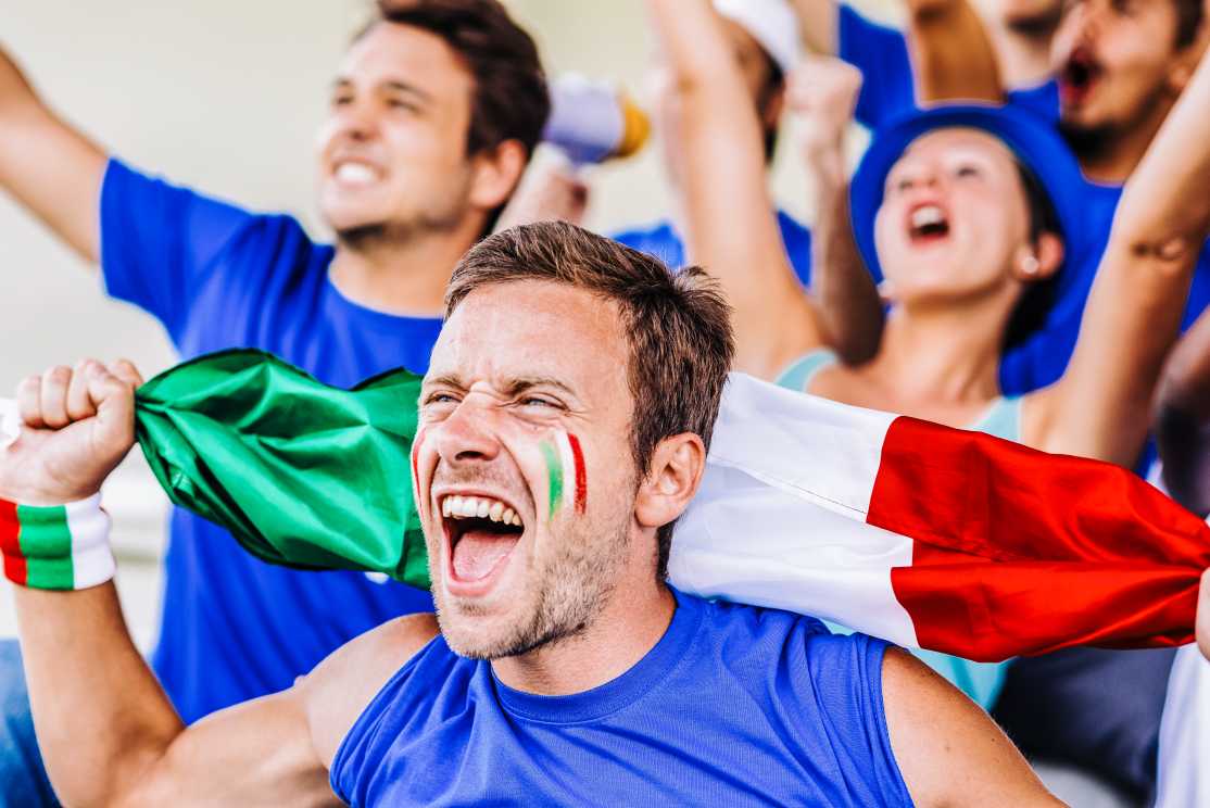 Supporters from Italy at stadium watching the match